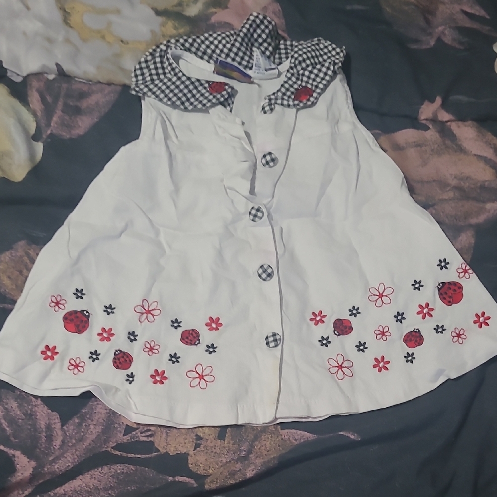 Charming White Dress with Ladybug and Flower Design
